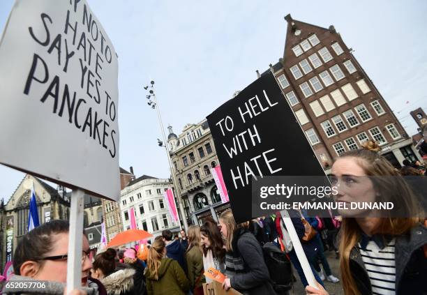 Women take part in the "Womens March for a united Netherlands" calling for people across the country to vote against hate ahead of the Dutch...