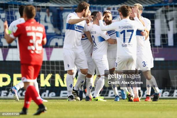 Sidney Sam of Darmstadt celebrates his team's second goal with team mates during the Bundesliga match between SV Darmstadt 98 and 1. FSV Mainz 05 at...