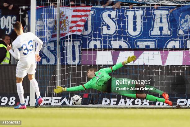 Sidney Sam of Darmstadt scores his team's second goal with a penalty against goalkeeper Jonas Loessl of Mainz during the Bundesliga match between SV...