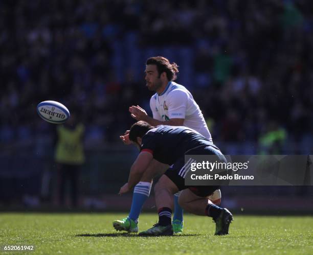 Luke McLean of Italy is tackled by Rabah Slimani of France during the RBS Six Nations match between Italy and France at Stadio Olimpico on March 11,...