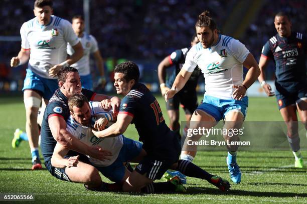 Luis Picamoles and Brice Dulin of France tackle of Giorgio Bronzini of Italy during the RBS Six Nations match between Italy and France at Stadio...