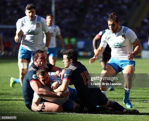 Luis Picamoles and Brice Dulin of France tackle of Giorgio Bronzini of Italy during the RBS Six Nations match between Italy and France at Stadio...