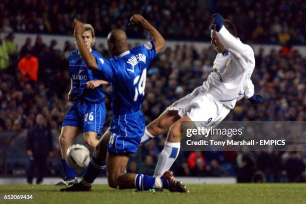 Leeds United's Mark Viduka's shot is blocked by Gillingham's Leon Johnson