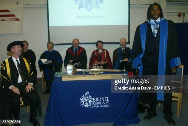 Audley Harrison gives a speech after being awarded an honoury degree by Professor Steve Hodkinson