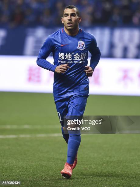 Carlos Tevez of Shanghai Shenhua reacts during the 2nd round match of CSL Chinese Football Association between Shanghai Shenhua and Tianjin Quanjian...