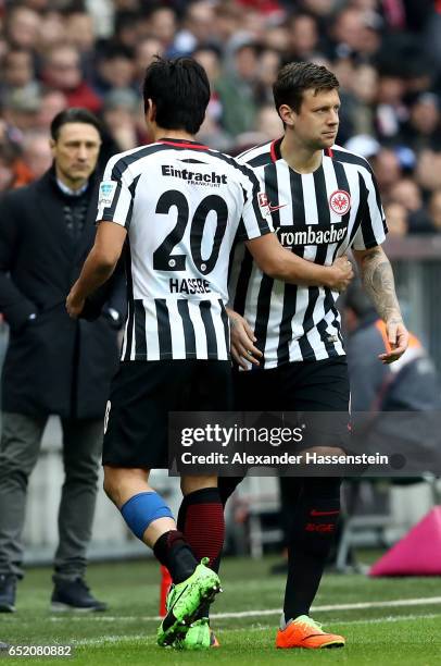 Makoto Hasebe of Frankfurt leaves the pitch for Marco Russ during the Bundesliga match between Bayern Muenchen and Eintracht Frankfurt at Allianz...