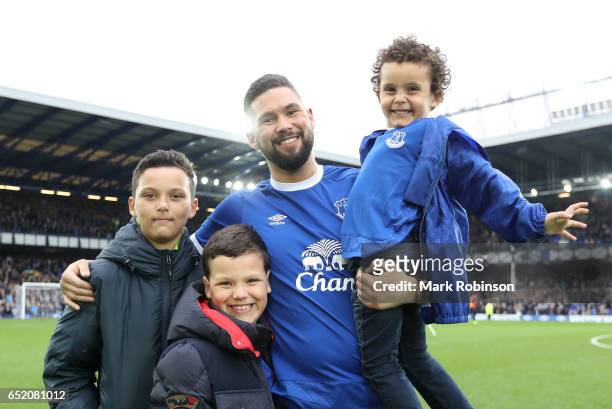 Boxer Tony Bellew poses with his sons at half time during the Premier League match between Everton and West Bromwich Albion at Goodison Park on March...