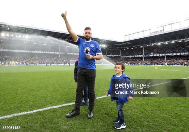 Boxer Tony Bellew salutes the crowd at half time during the Premier League match between Everton and West Bromwich Albion at Goodison Park on March...