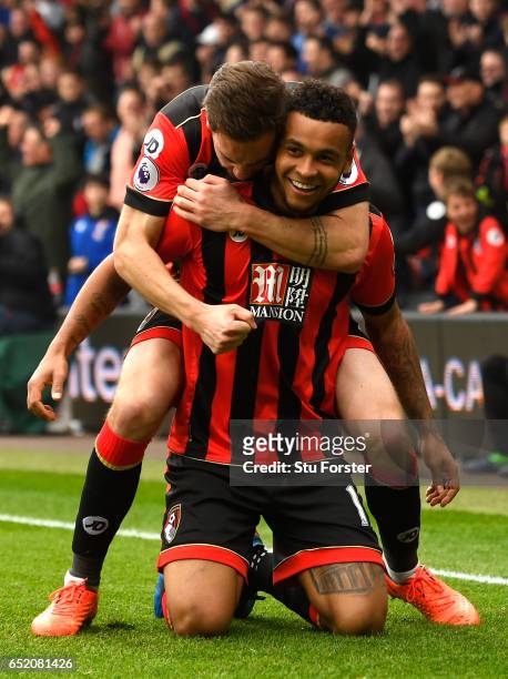 Joshua King of AFC Bournemouth celebrates with Dan Gosling as he scores their second goal during the Premier League match between AFC Bournemouth and...