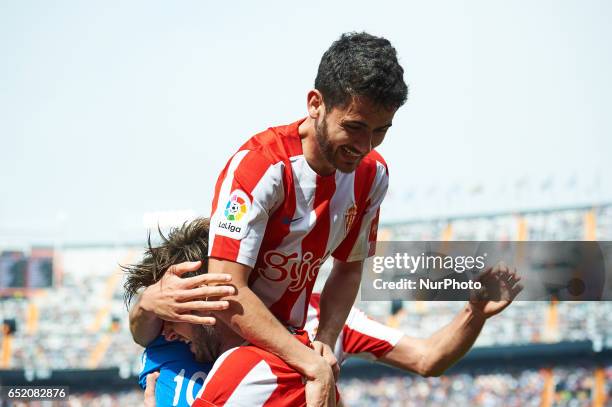Duje Cop and Nacho Cases of Real Sporting de Gijon celebrates their goal during their La Liga match between Valencia CF and Real Sporting de Gijon at...