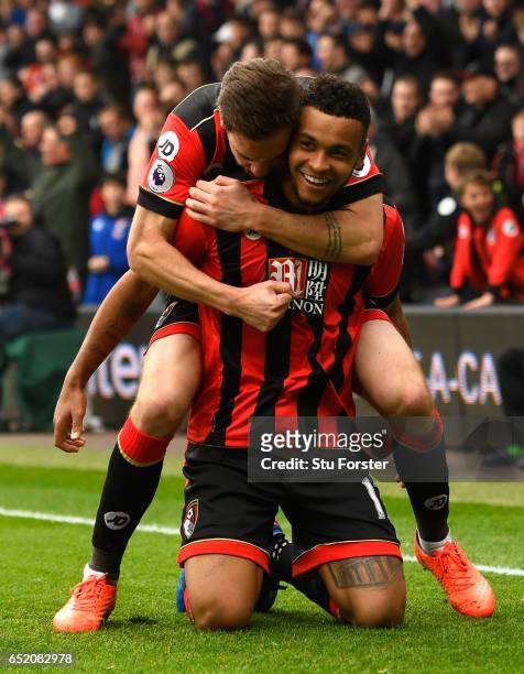 Joshua King of AFC Bournemouth celebrates scoring his sides second goal with Dan Gosling during the Premier League match between AFC Bournemouth and...