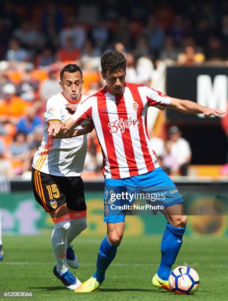 Fabian Orellana of Valencia CF and Mikel Vesga of Real Sporting de Gijon during their La Liga match between Valencia CF and Real Sporting de Gijon at...