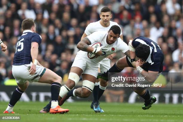 Courtney Lawes of England hands off Zander Fagerson of Scotland during the RBS Six Nations match between England and Scotland at Twickenham Stadium...