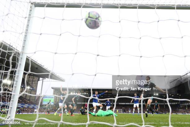 Kevin Mirallas of Everton scores their first goal during the Premier League match between Everton and West Bromwich Albion at Goodison Park on March...