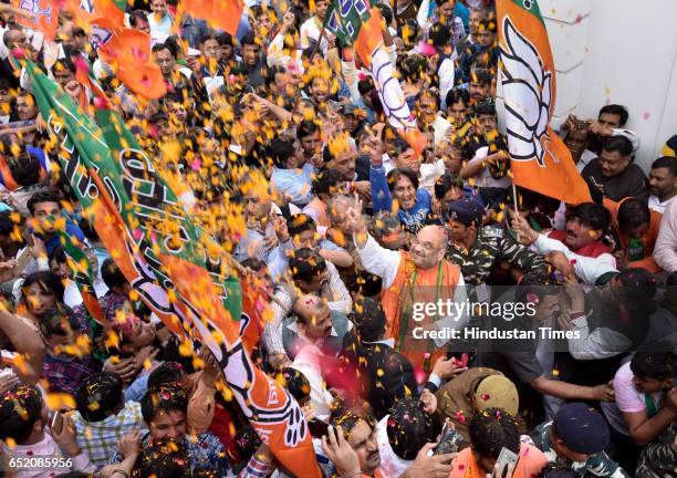 President Amit Shah arrives to address a press conference after landslide victory in Uttar Pradesh and Uttarakhand assembly elections at BJP HQ at...