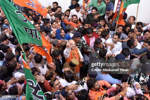 President Amit Shah arrives to address a press conference after landslide victory in Uttar Pradesh and Uttarakhand assembly elections at BJP HQ at...