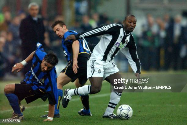Newcastle United's Lomana LuaLua holds off Inter Milan's Francesco Coco