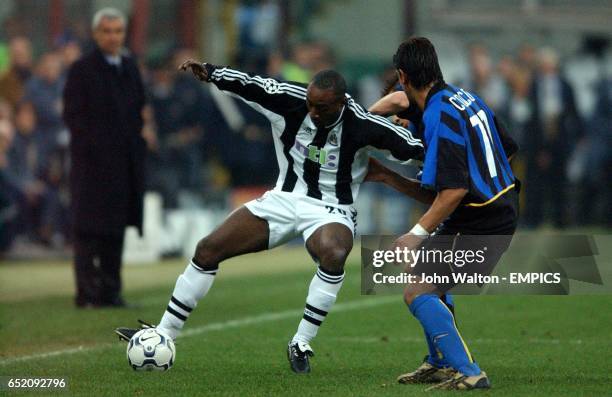 Newcastle United's Lomana LuaLua holds off Inter Milan's Francesco Coco