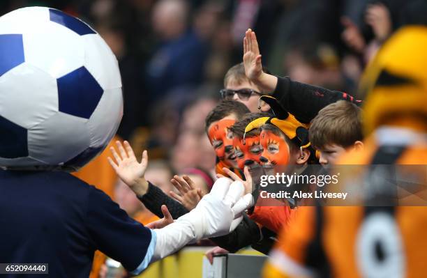 Fans enjoy the atmosphere at half time during the Premier League match between Hull City and Swansea City at KCOM Stadium on March 11, 2017 in Hull,...