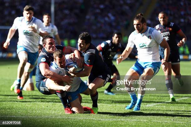 Luis Picamoles and Brice Dulin of France tackle of Giorgio Bronzini of Italy during the RBS Six Nations match between Italy and France at Stadio...