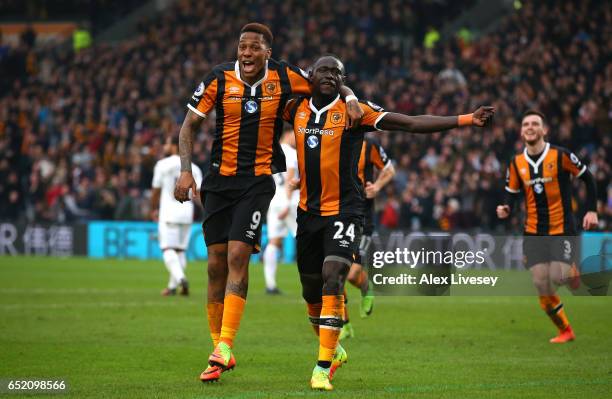 Oumar Niasse of Hull City celebrates with Abel Hernandez as he scores their first goal during the Premier League match between Hull City and Swansea...