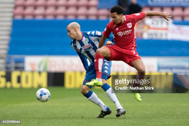 Korey Smith of Bristol City and Gabriel Obertan of Wigan Athletic in action during the Sky Bet Championship match between Wigan Athletic and Bristol...