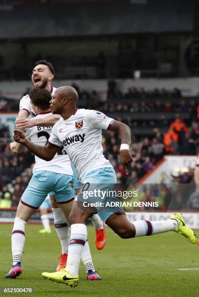 West Ham United's French-born Ghanaian midfielder Andre Ayew celebrates after scoring their second goal during the English Premier League football...