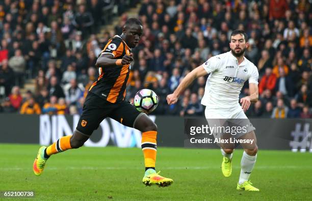 Oumar Niasse of Hull City scores their second goal during the Premier League match between Hull City and Swansea City at KCOM Stadium on March 11,...