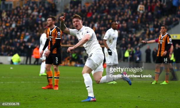 Alfie Mawson of Swansea City celebrates as he scores their first goal during the Premier League match between Hull City and Swansea City at KCOM...