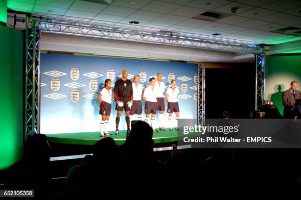 England's Rachel Yankey, David James, David Beckham, Michael Owen, Rio Ferdinand and Casey Stoney show the new England home kit.