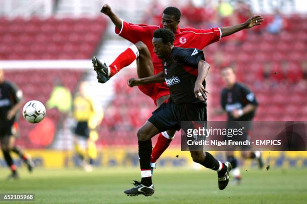 Middlesbrough's George Boateng and Charlton Athletic's Jason Euell battle for the ball