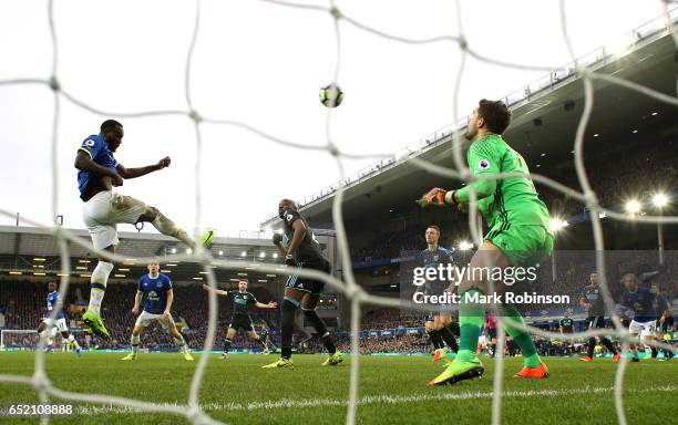 Romelu Lukaku of Everton scores his sides third goal past goalkeeper Ben Foster of West Bromwich Albion during the Premier League match between...