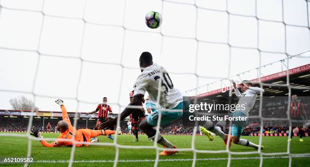 Joshua King of Bournemouth scores the winning goal past goalkeeper Darren Rudolph and Michail Antonio during the Premier League match between AFC...