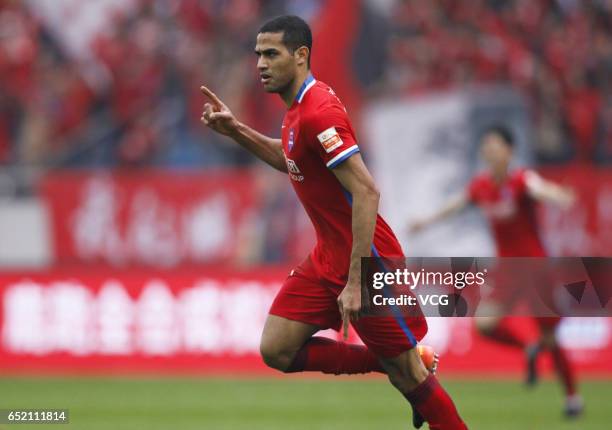 Alan Kardec of Chongqing Lifan celebrates after scoring his team's first goal during the 2nd round match of CSL Chinese Football Association between...