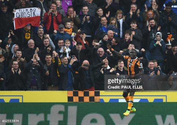 Hull City's Senegalese striker Oumar Niasse celebrates scoring his second goal during the English Premier League football match between Hull City and...