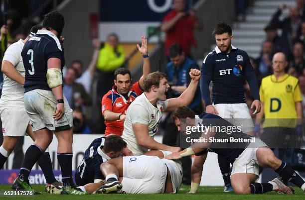 Joe Launchbury of England celebrates his sides fifth try during the RBS Six Nations match between England and Scotland at Twickenham Stadium on March...