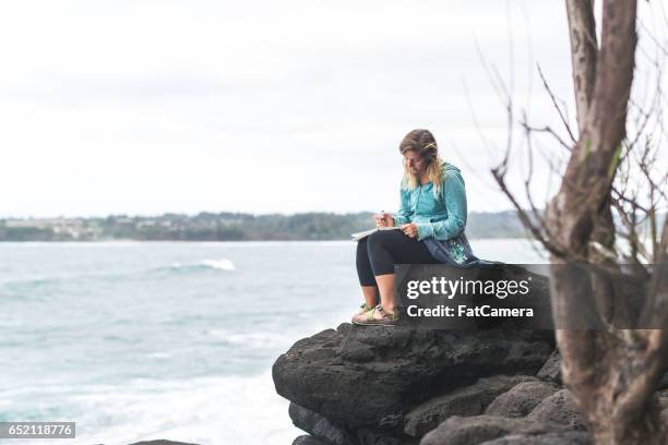 Woman Rocks Writing Spiritual Woman Writing Photos and Premium High Res Pictures - Getty Images