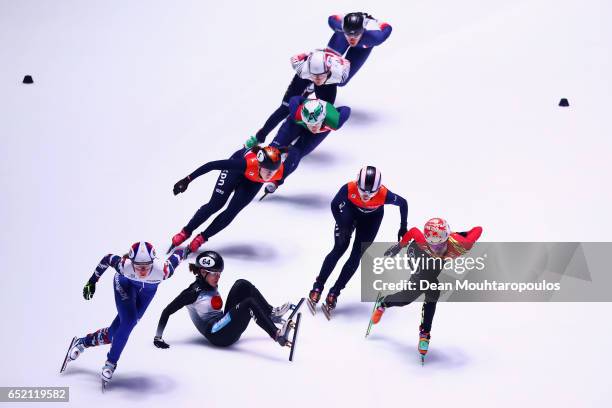 Sumire Kikuchi of Japan falls on the ice and crashes out of the 1500m Semifinals race at ISU World Short track Speed Skating Championships held at...