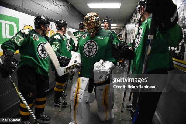 Tuukka Rask of the Boston Bruins leads the team out for warm ups before the game against the Philadelphia Flyers at the TD Garden on March 11, 2017...