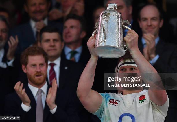 England's hooker Dylan Hartley poses with the Calcutta Cup trophy atfter winning the Six Nations international rugby union match between England and...