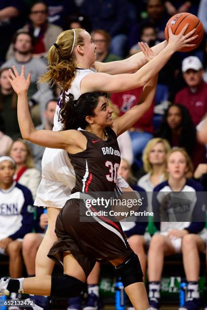 Shayna Mehta of the Brown Bears can't get the ball from Ashley Russell of the Pennsylvania Quakers during the fourth quarter at The Palestra during...