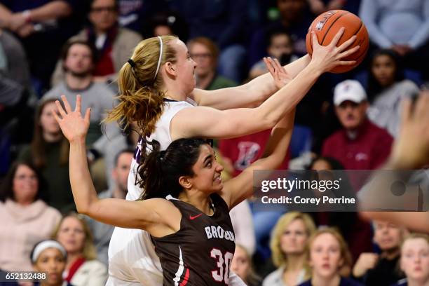 Shayna Mehta of the Brown Bears can't get the ball from Ashley Russell of the Pennsylvania Quakers during the fourth quarter at The Palestra during...