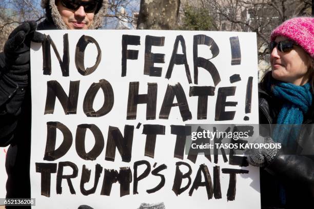 Demonstrators gather near The White House to protest President Donald Trump's travel ban on six Muslim countries on March 11, 2017 in Washington, DC....