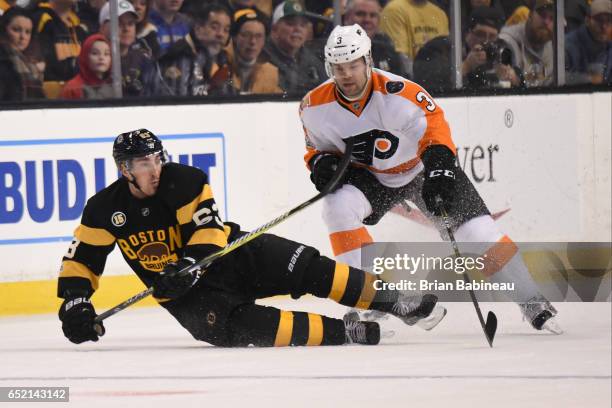 Brad Marchand of the Boston Bruins against Radko Gudas of the Philadelphia Flyers at the TD Garden on March 11, 2017 in Boston, Massachusetts.