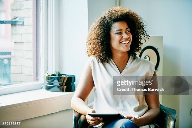 smiling businesswoman in discussion during meeting - transparent blouse stock pictures, royalty-free photos & images