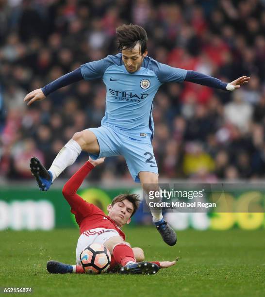 David Silva of Manchester City in action with Marten de Roon of Middlesbrough during The Emirates FA Cup Quarter-Final match between Middlesbrough...