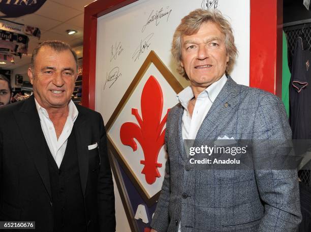 Fatih Terim , current Turkish national football manager and former head coach of ACF Fiorentina poses with Giancarlo Antognoni of Fiorentina as he...