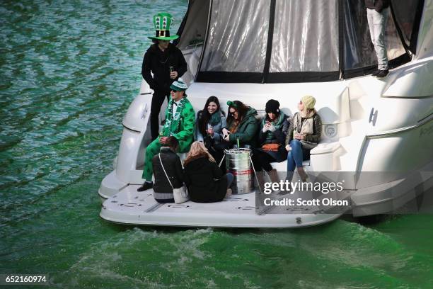 Boaters navigate the Chicago River shortly after it was dyed green in celebration of St. Patrick's Day on March 11, 2017 in Chicago, Illinois. Dyeing...