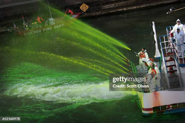 Workers dye the Chicago River green in celebration of St. Patrick's Day on March 11, 2017 in Chicago, Illinois. Dyeing the river has been a St....