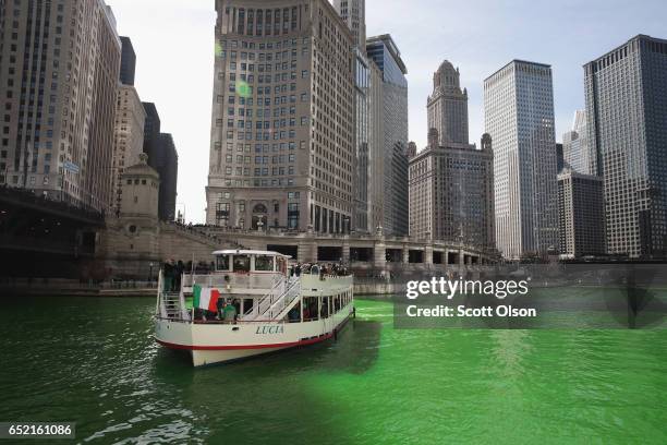 Tour boat navigates the Chicago River shortly after it was dyed green in celebration of St. Patrick's Day on March 11, 2017 in Chicago, Illinois....